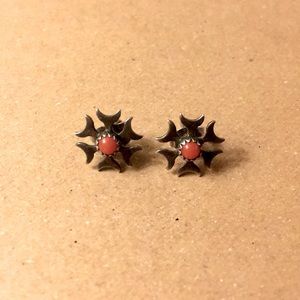 Small silver stud earrings with red stones